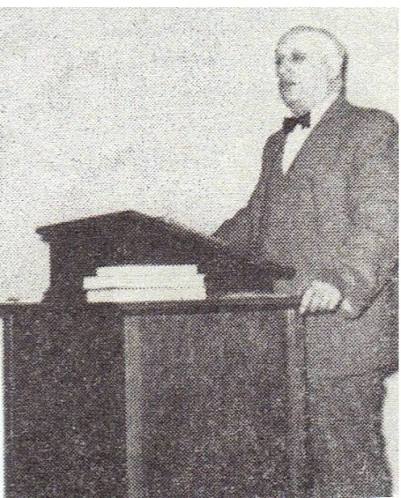 Bro. Clarence Walker preaching from the pulpit